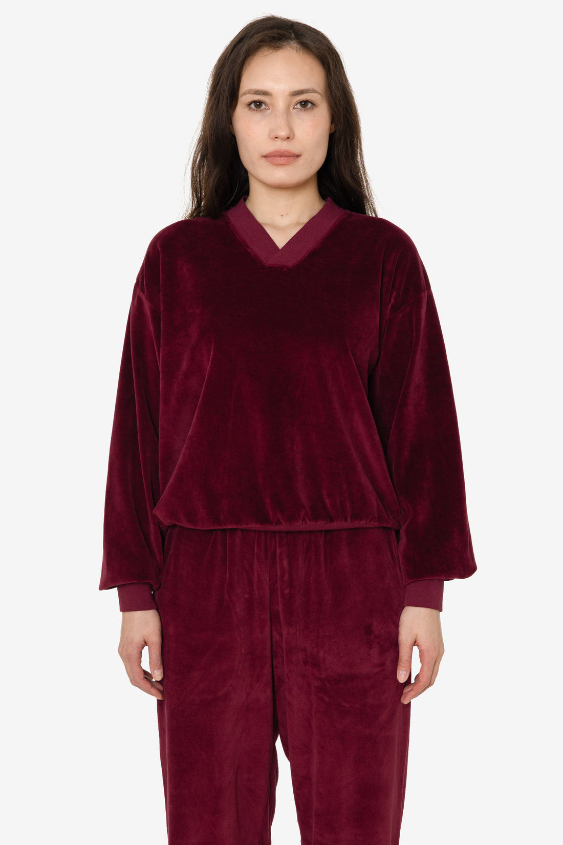 Model wearing a Burgandy Unisex Velour V-neck Sweatshirt and Sweat Pant