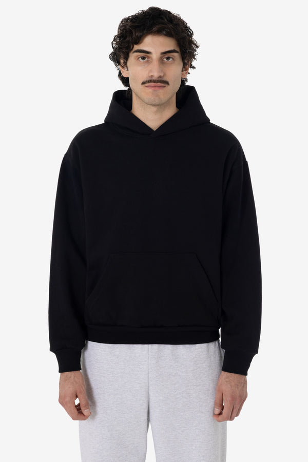 Model wearing a black Los Angeles Apparel 14 ounce Heavy Fleece hoodie