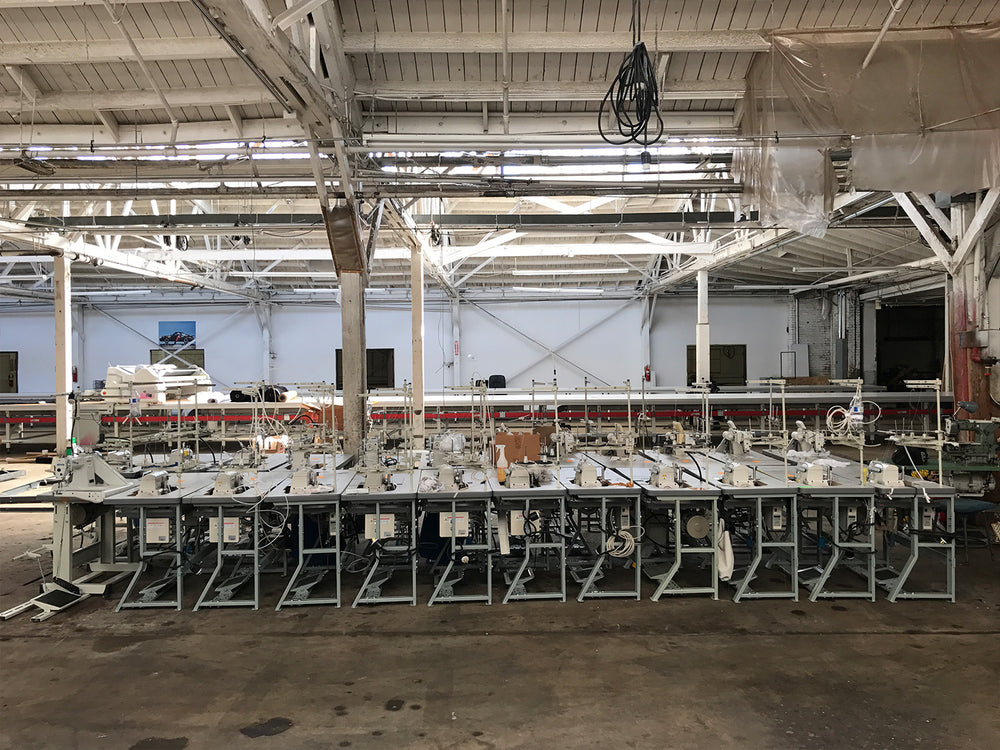 Rows of sewing machines on the Los Angeles Apparel production floor.