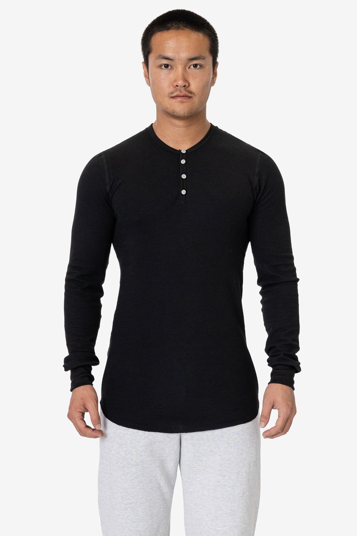 Model wearing the black Poly-Cotton Thermal Long Sleeve Henley with visible button placket