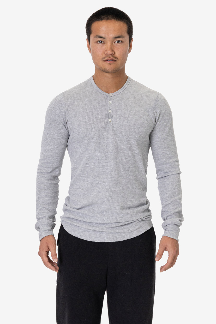 Model wearing the Heather Grey Poly-Cotton Thermal Long Sleeve Henley as a lightweight first layer