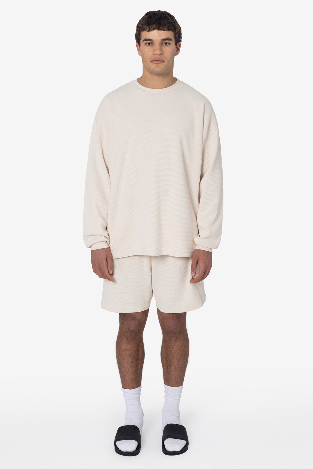 Model wearing the Creme Heavy Thermal Garment Dye Shorts with a matching thermal top